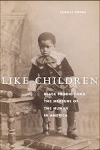 Like Children Historical photograph of a young Black child next to small table.